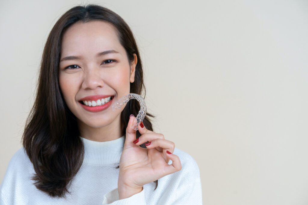 If you're considering orthodontic treatment but are hesitant about the aesthetic impact of metal brackets and wires on your smile, then Invisalign might be the right solution for you.